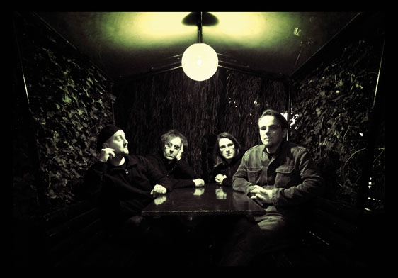 Here are the PT guys in... a camouflaged bunker? A tree-walled cafe? Steve Wilson is the long haired gent, second from the right. Here are the PT guys in... a camouflaged bunker? A tree-walled cafe? Steve Wilson is the long haired gent, second from the right.
